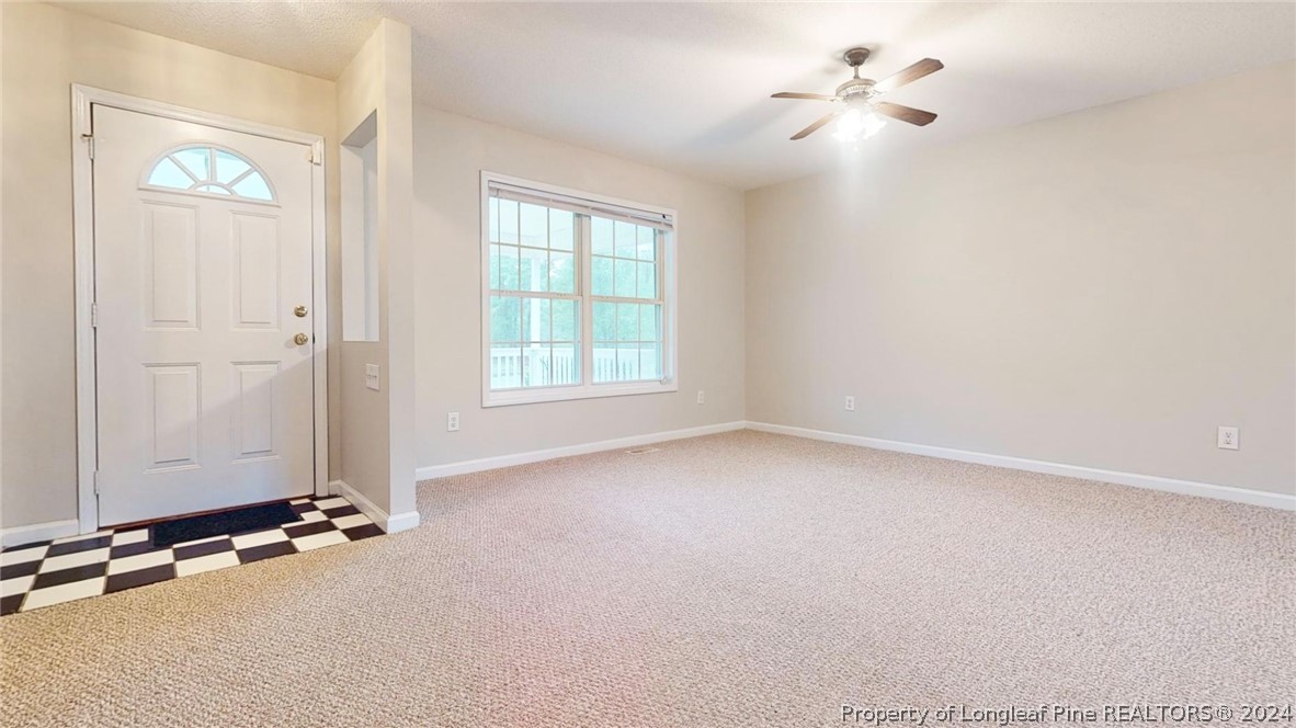 1340 Roseland Road Aberdeen, NC 28315 - Photo 4 of 39 an empty room with windows