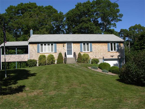 4 Farnum Road Bourne, MA 02532 - Photo 1 of 14 a front view of a house with a garden