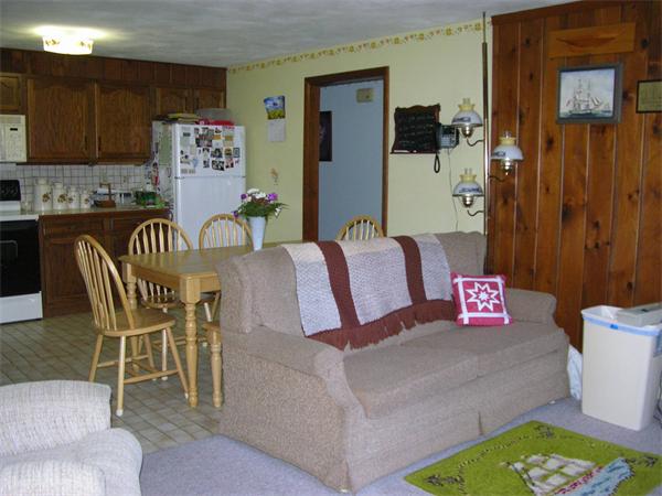 4 Farnum Road Bourne, MA 02532 - Photo 5 of 14 a living room with furniture and a rug