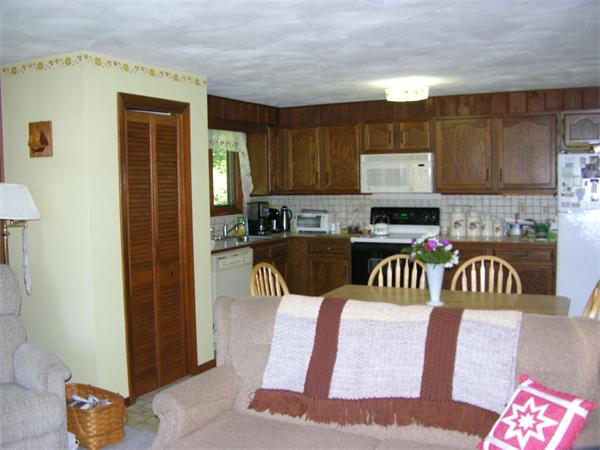 4 Farnum Road Bourne, MA 02532 - Photo 6 of 14 a kitchen with a refrigerator a stove a sink and a cabinets