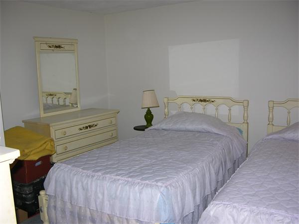 4 Farnum Road Bourne, MA 02532 - Photo 10 of 14 a bedroom with a bed and a mirror