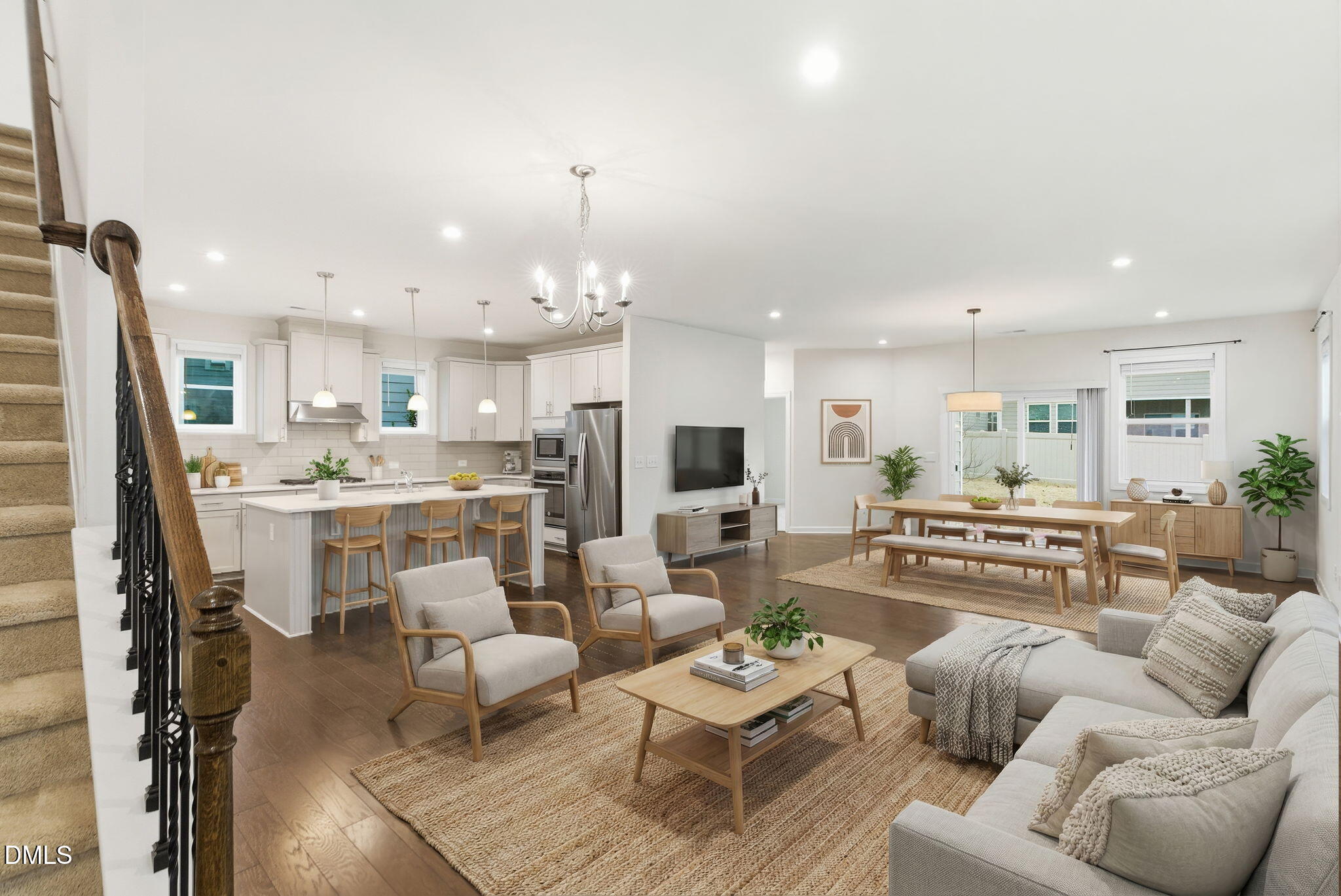 2913 Macbeth Lane Apex, NC 27502 - Photo 11 of 62 a living room with furniture kitchen view and a chandelier