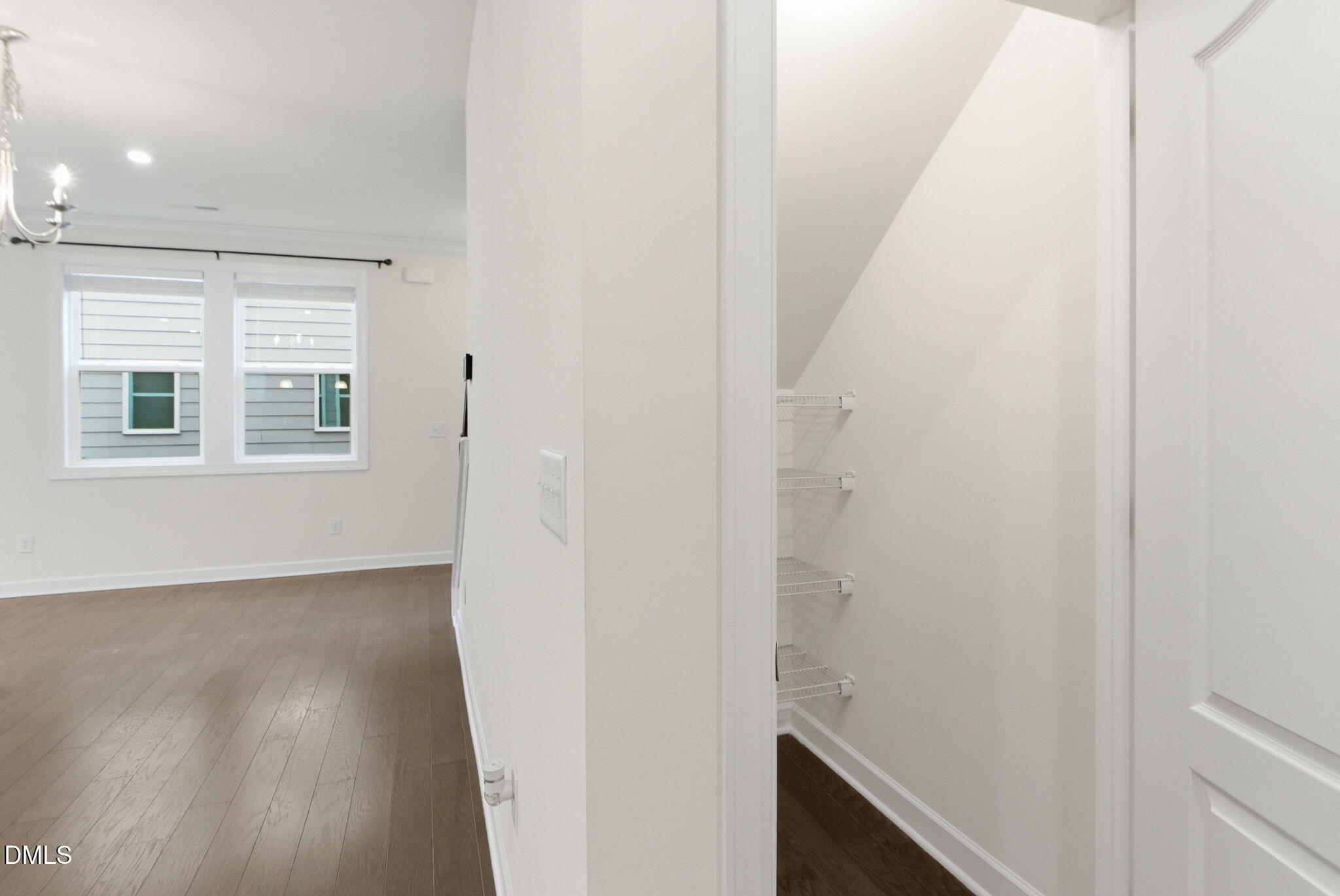 2913 Macbeth Lane Apex, NC 27502 - Photo 22 of 62 a view of an empty room with wooden floor and a window