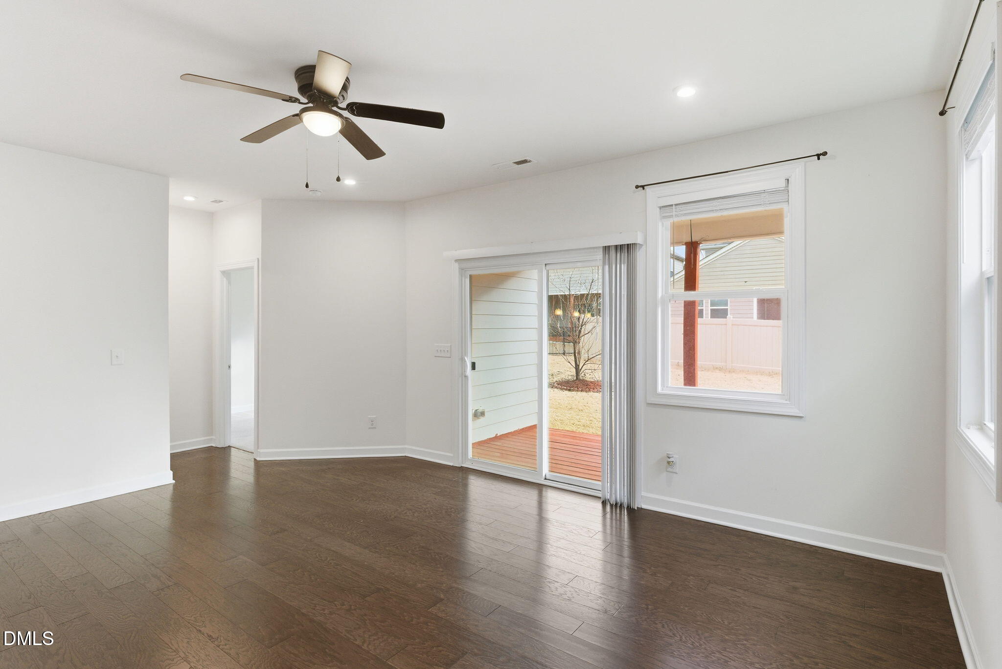 2913 Macbeth Lane Apex, NC 27502 - Photo 25 of 62 an empty room with wooden floor closet and windows