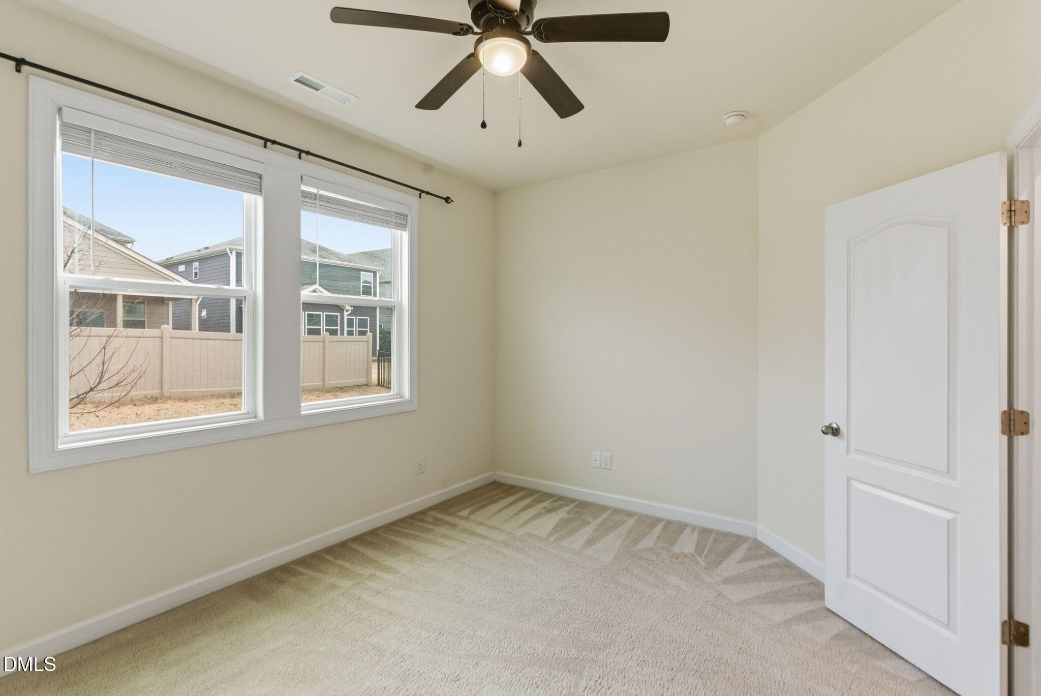 2913 Macbeth Lane Apex, NC 27502 - Photo 27 of 62 a view of an empty room with a window