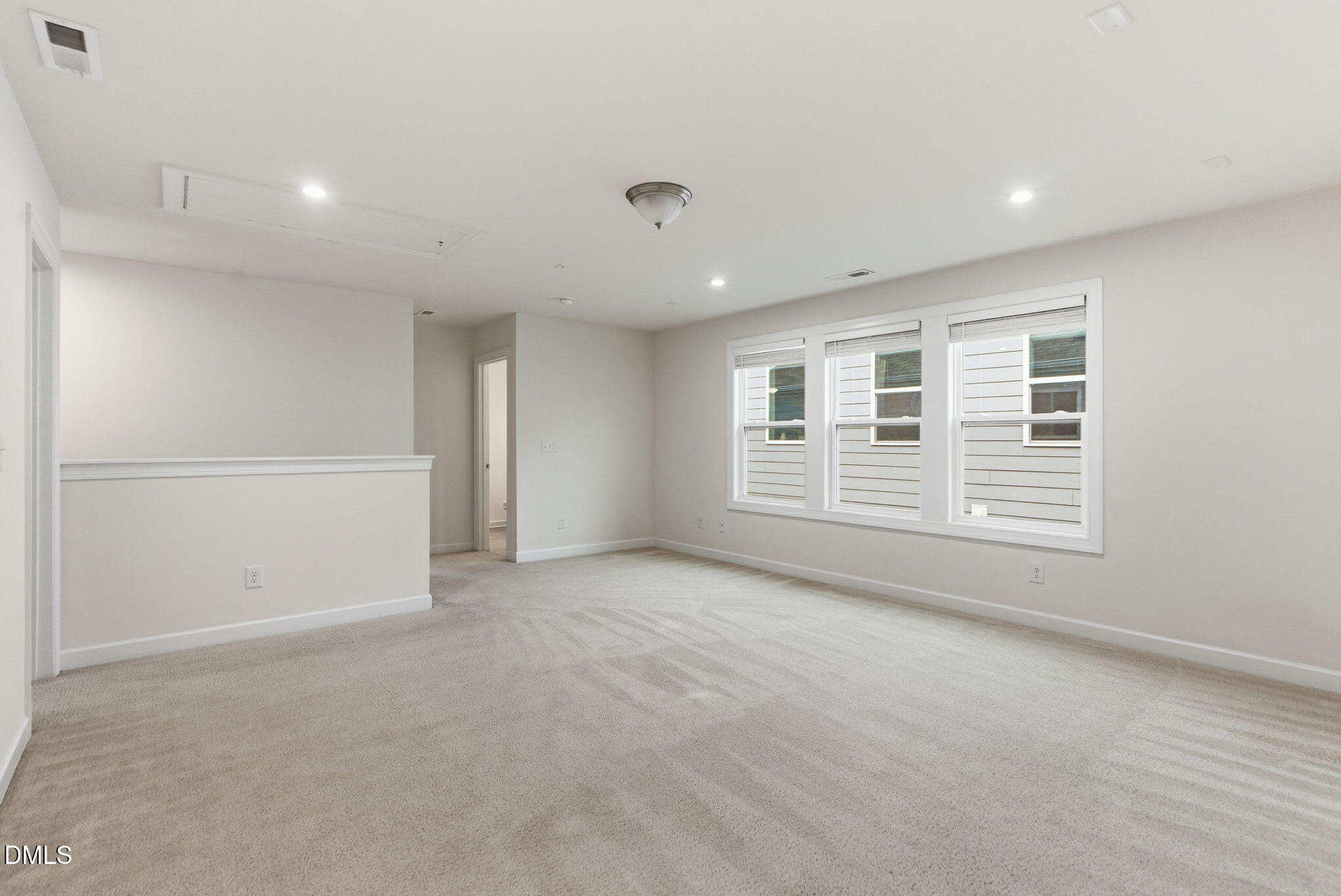 2913 Macbeth Lane Apex, NC 27502 - Photo 30 of 62 a view of an empty room with a window