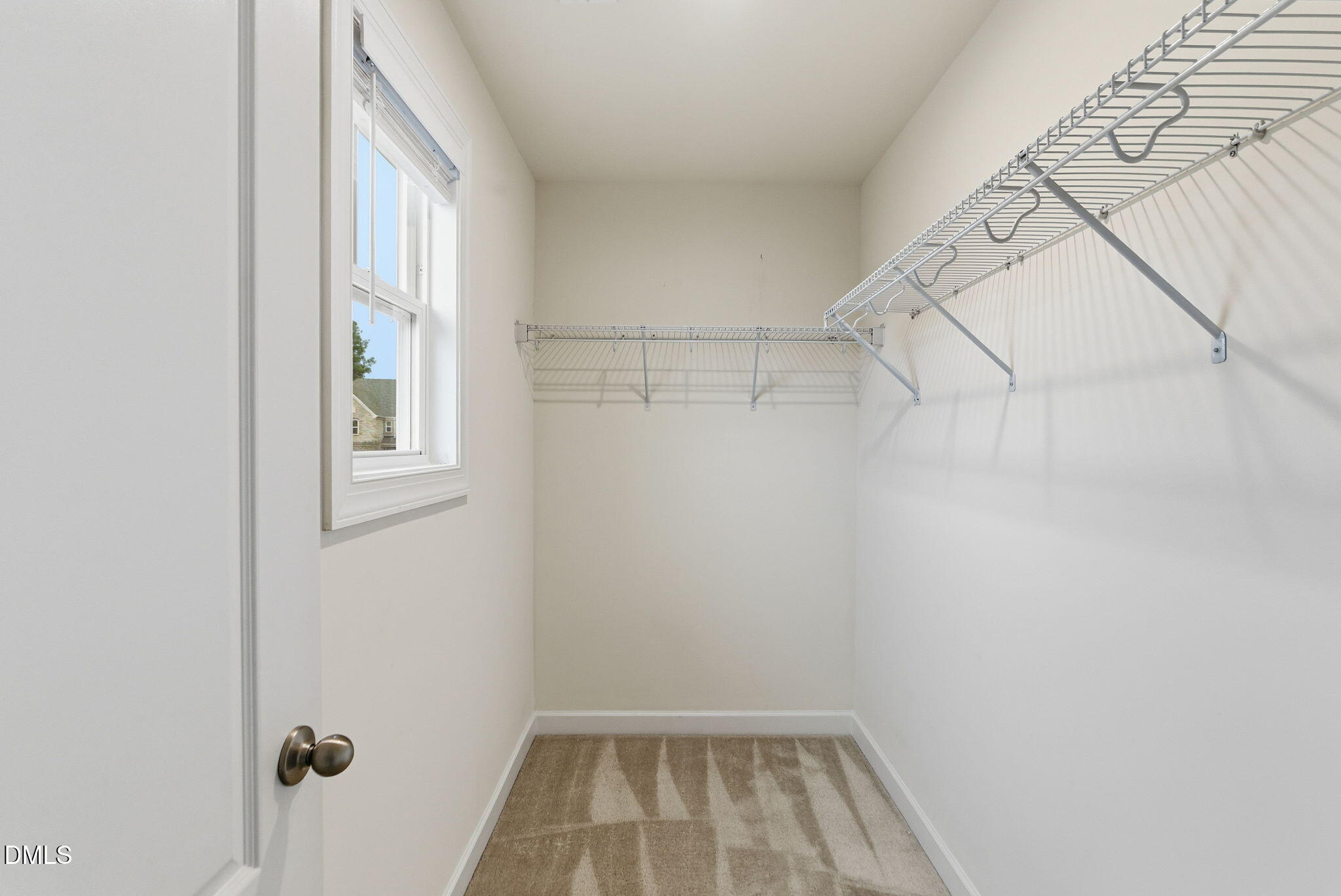 2913 Macbeth Lane Apex, NC 27502 - Photo 34 of 62 a view of a room with racks on the wall