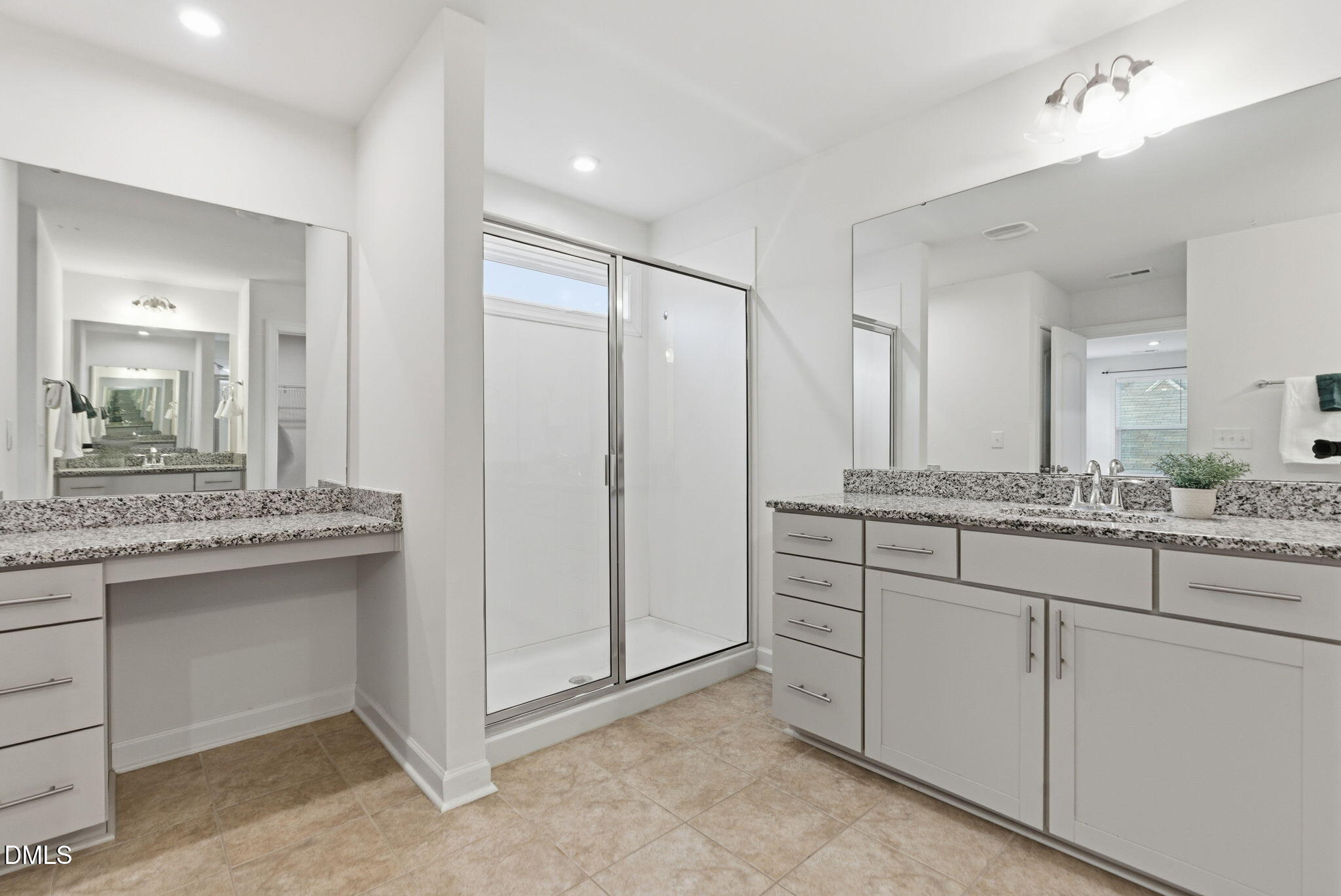 2913 Macbeth Lane Apex, NC 27502 - Photo 44 of 62 a bathroom with a granite countertop sink and a mirror