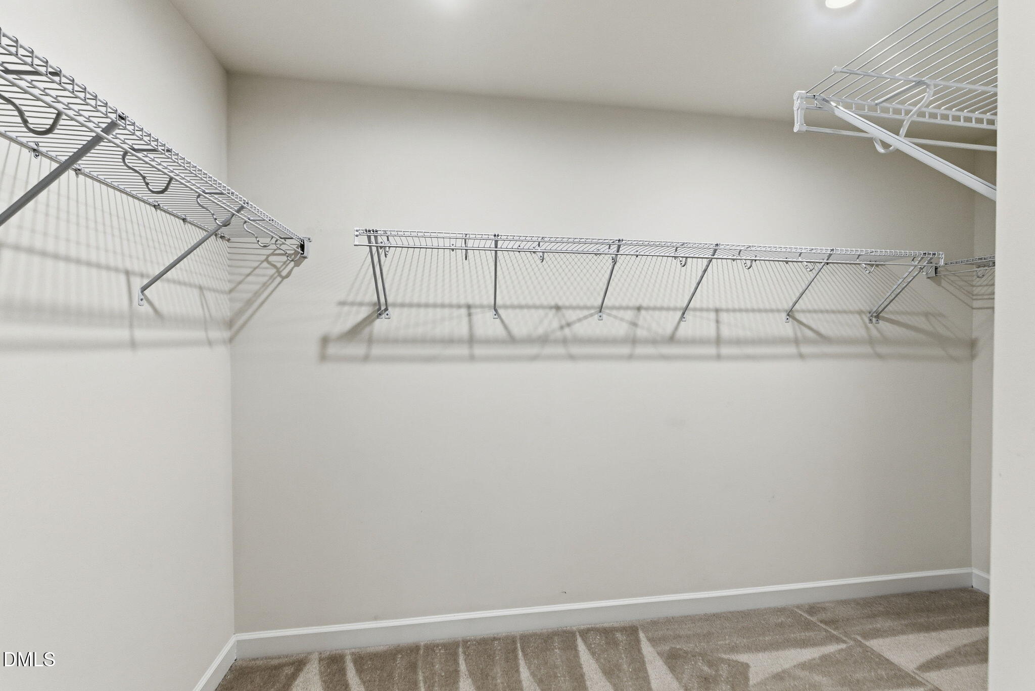 2913 Macbeth Lane Apex, NC 27502 - Photo 52 of 62 a view of a room with racks on the wall