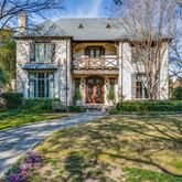 a view of a brick building next to a yard