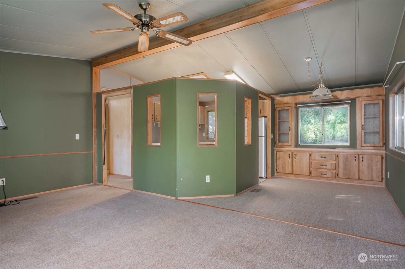 1554 East Roy Road Freeland, WA 98249 - Photo 7 of 24 en empty room with windows and ceiling fan
