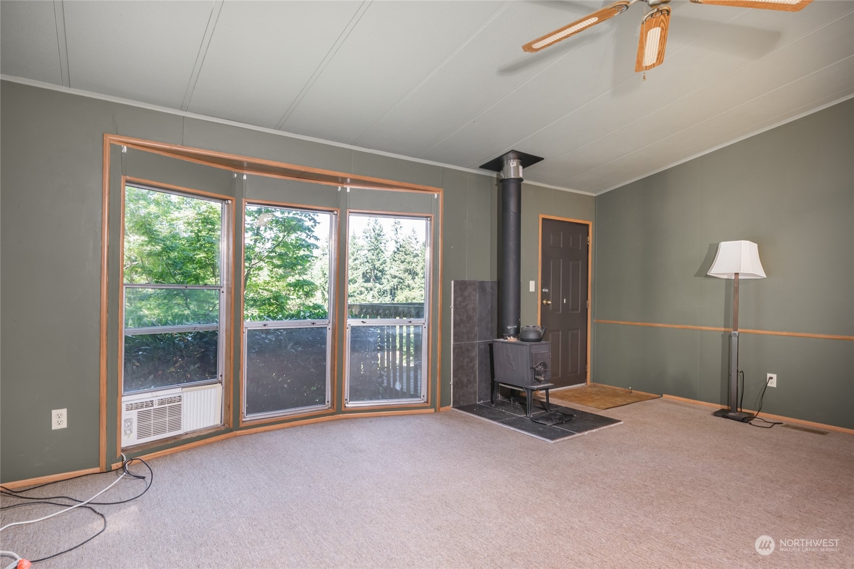 1554 East Roy Road Freeland, WA 98249 - Photo 8 of 24 a view of a room with gym equipment and windows