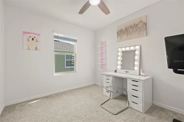 a view of a workspace with furniture