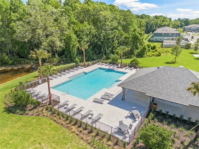 a view of a street with a large trees