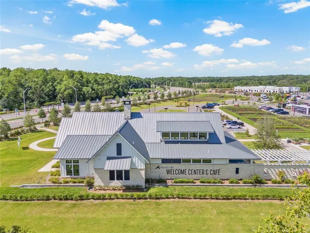 a front view of a house with a lake view