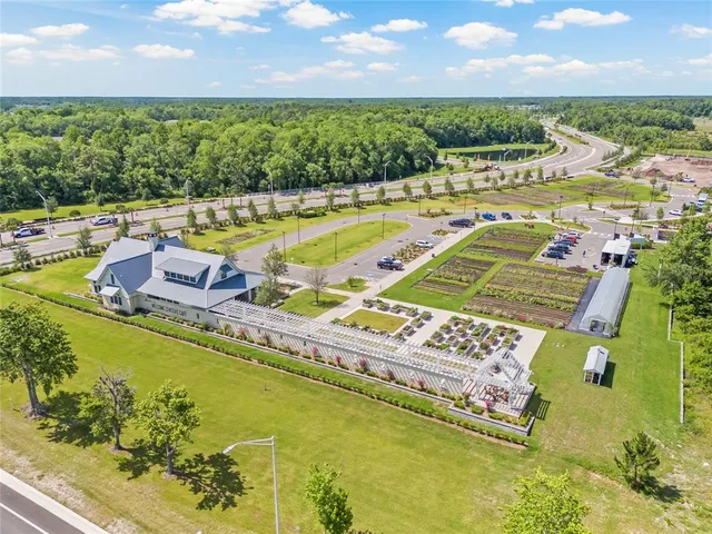 a view of a swimming pool with an outdoor seating and lake view