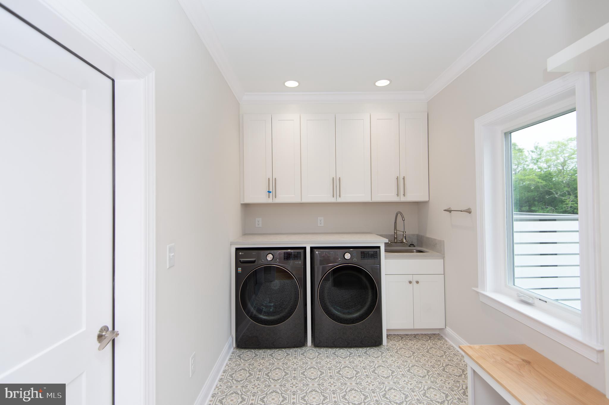 2202 Horns Point Road Cambridge, MD 21613 - Photo 31 of 74 Laundry room w/front loading washer/dryer