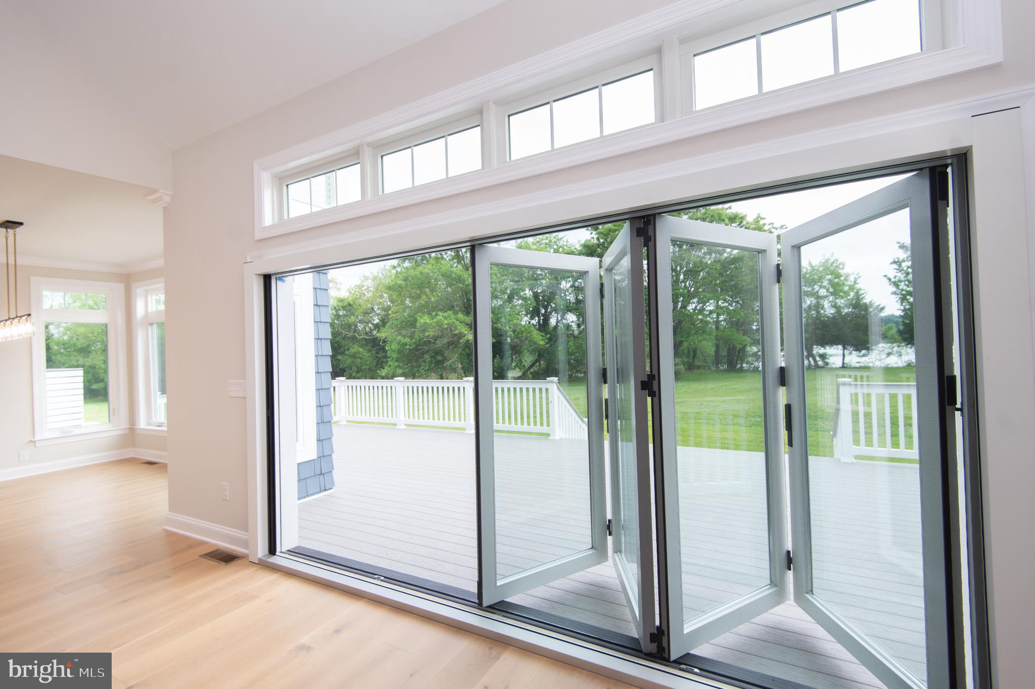 2202 Horns Point Road Cambridge, MD 21613 - Photo 39 of 74 Folding glass doors in Living room to deck