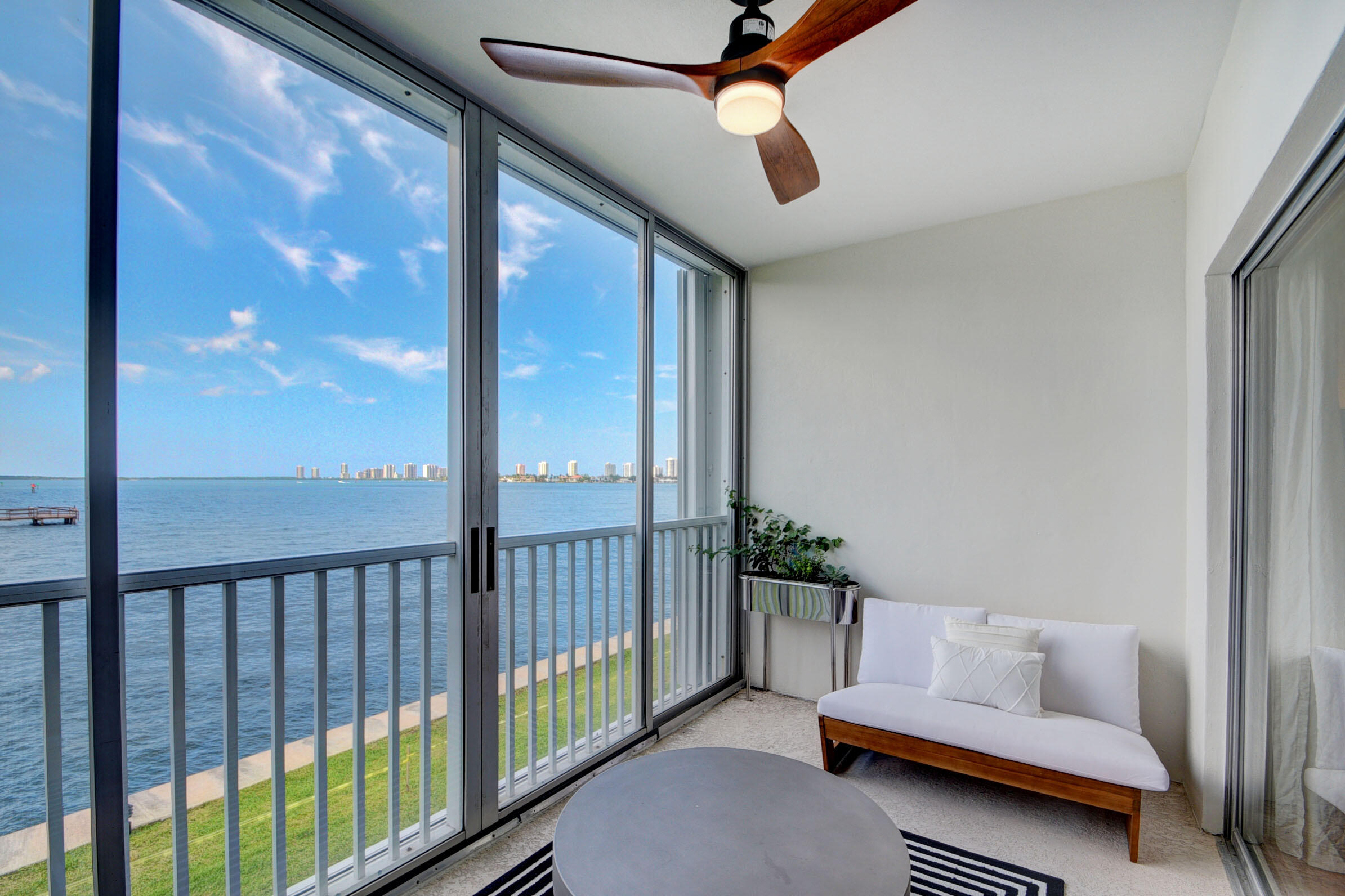 410 Wilma Circle, Unit 204 Riviera Beach, FL 33404 - Photo 11 of 25 a bedroom with furniture and a window