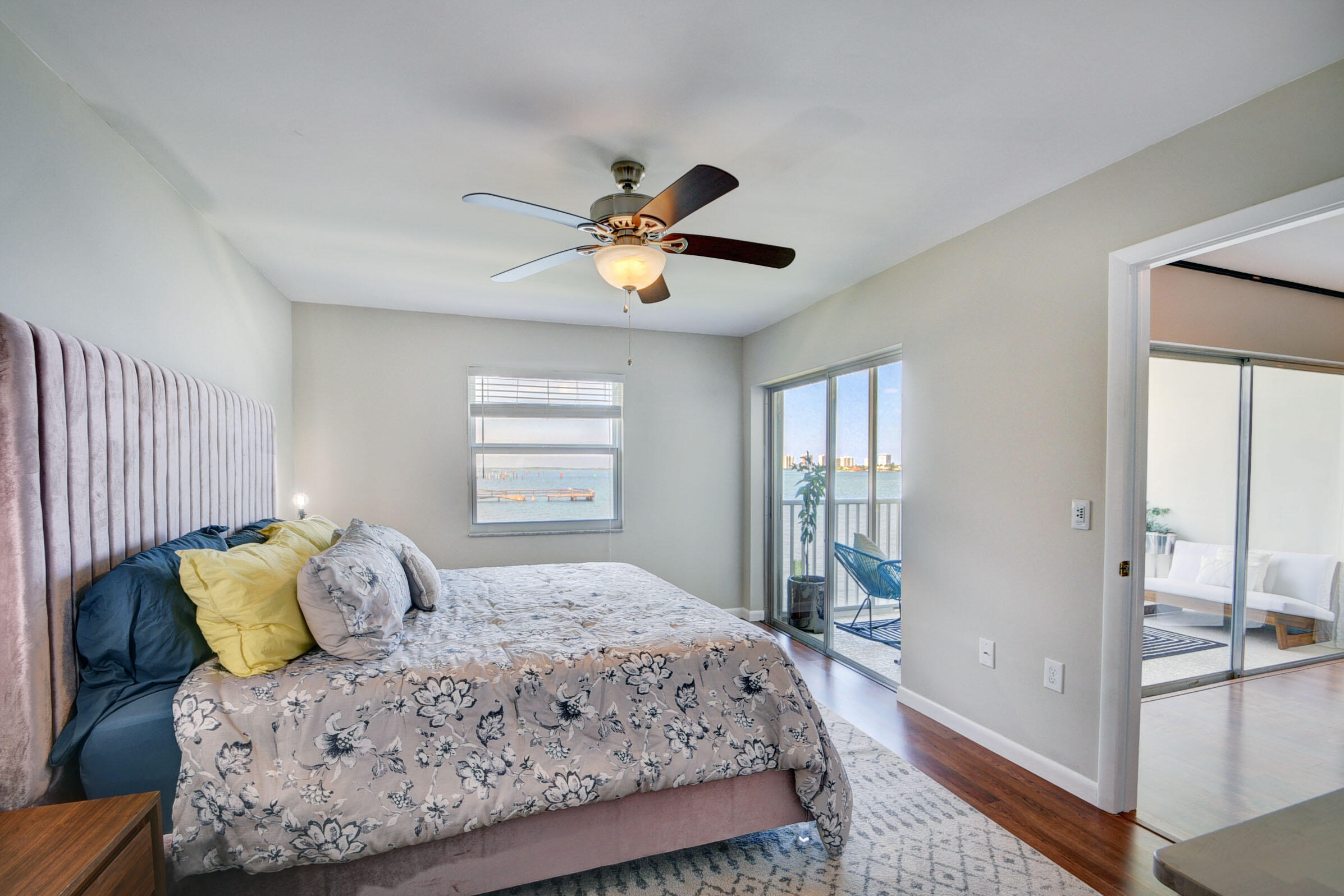 410 Wilma Circle, Unit 204 Riviera Beach, FL 33404 - Photo 17 of 25 a bedroom with a large bed and a chandelier
