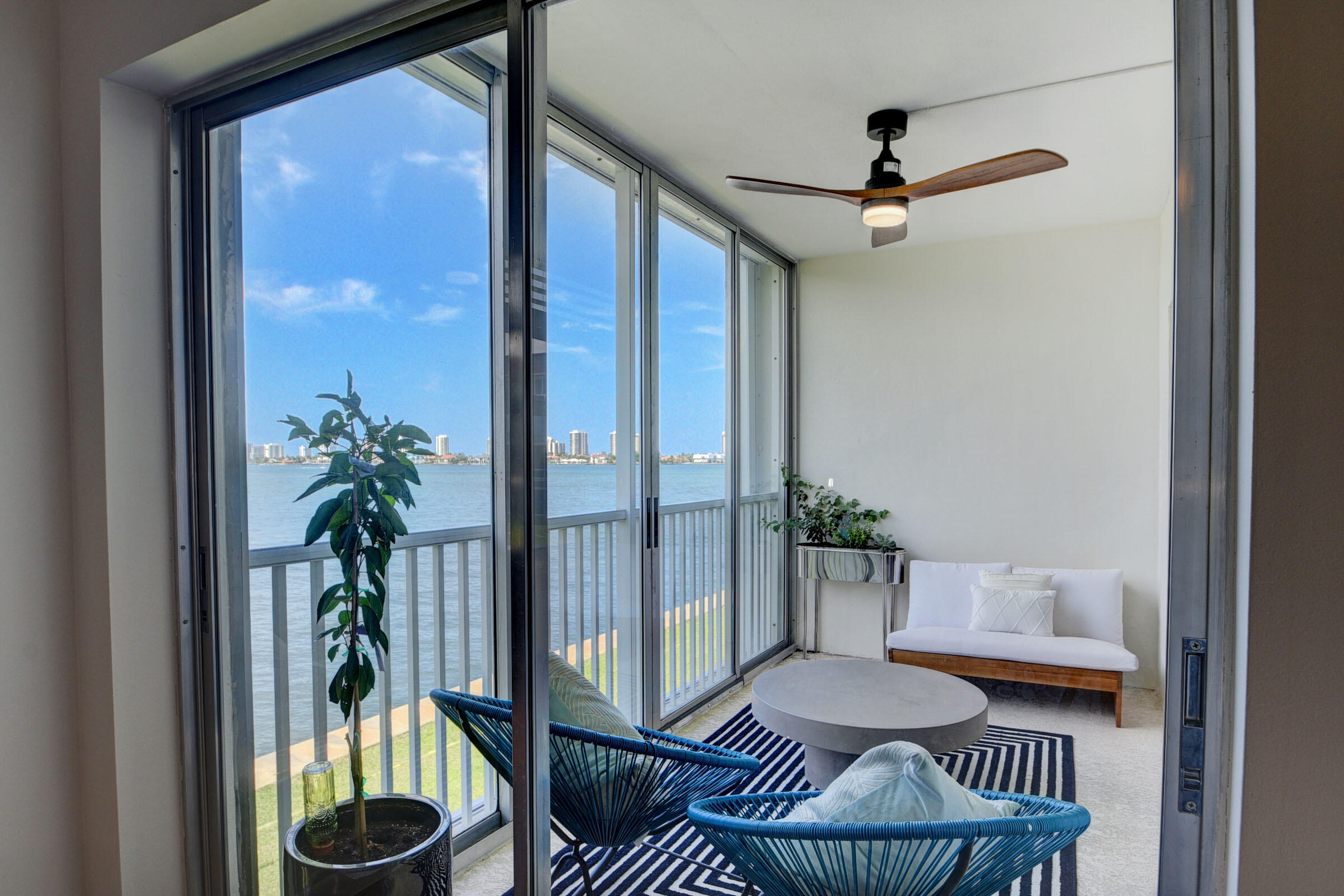 410 Wilma Circle, Unit 204 Riviera Beach, FL 33404 - Photo 19 of 25 a living room with furniture and a potted plant