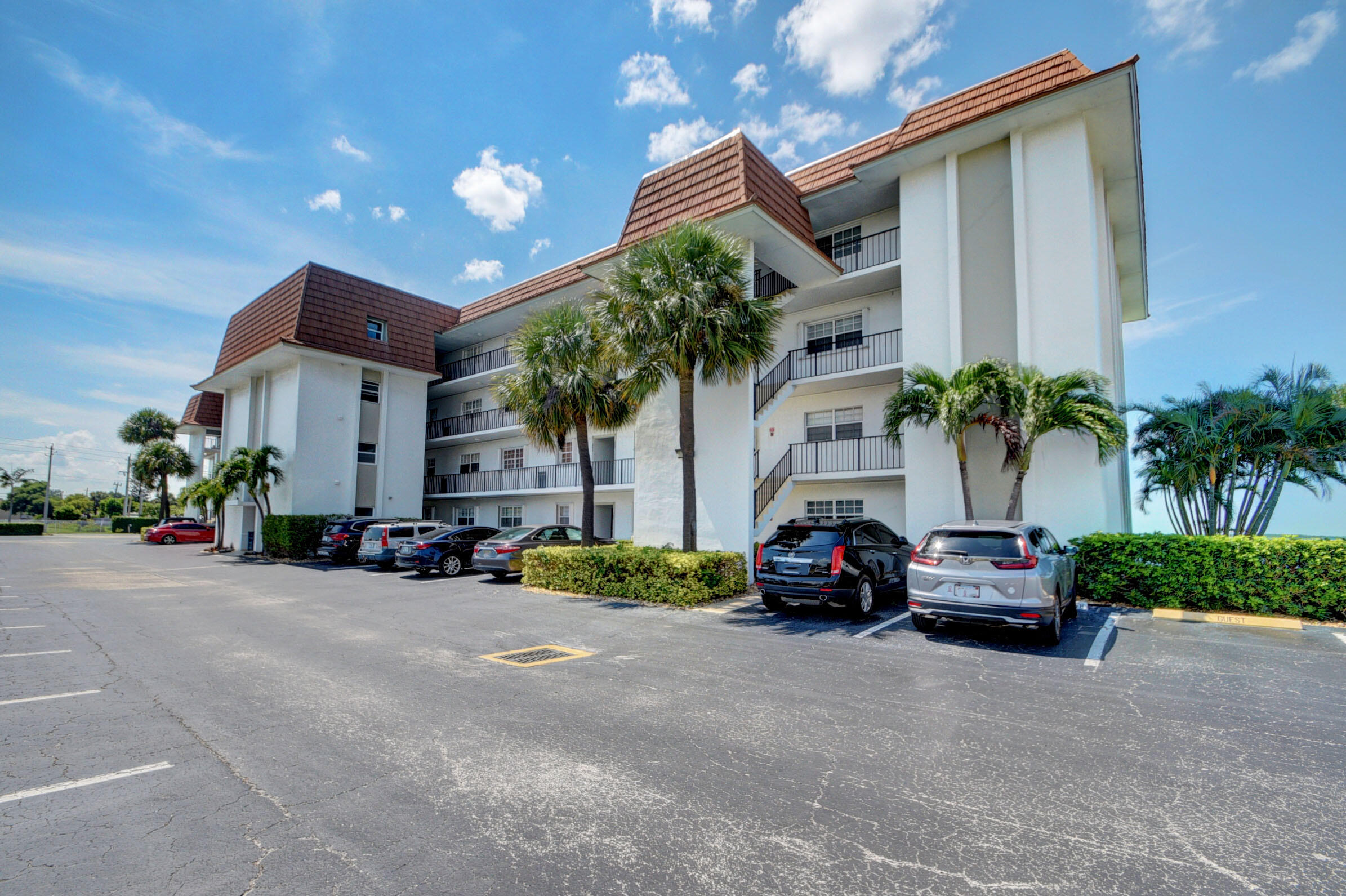 410 Wilma Circle, Unit 204 Riviera Beach, FL 33404 - Photo 25 of 25 a car parked in front of a house