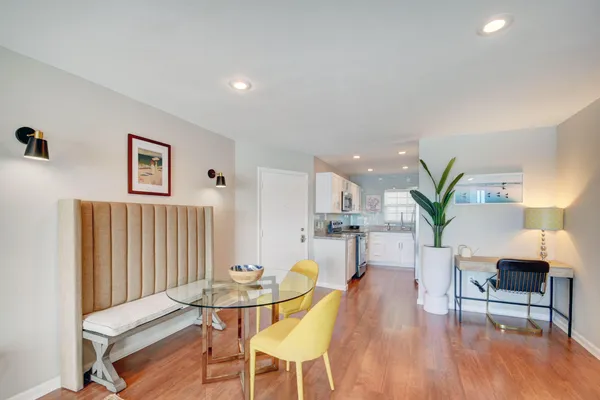 a kitchen with stainless steel appliances granite countertop a sink stove and microwave