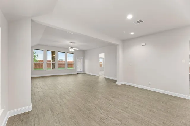 a kitchen with stainless steel appliances granite countertop a sink and a stove
