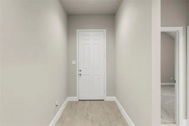 a view of a big room with a kitchen