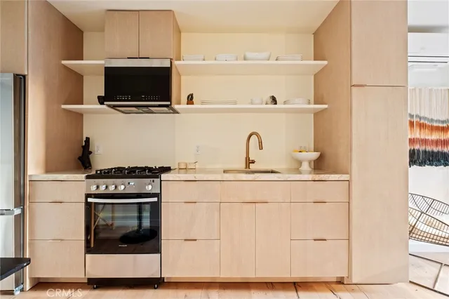 a kitchen with a stove and a microwave