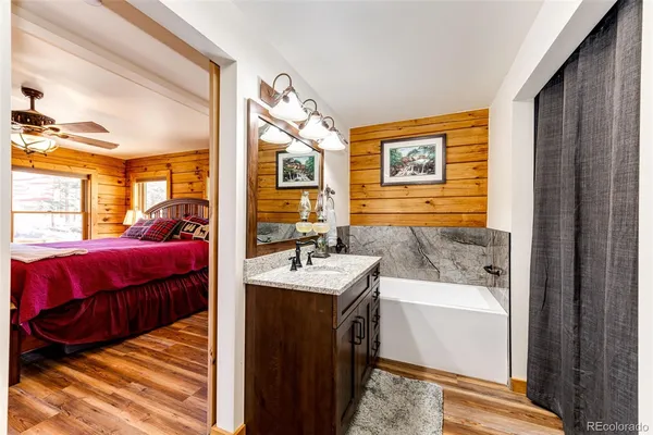 a en suite bathroom with a sink and a mirror