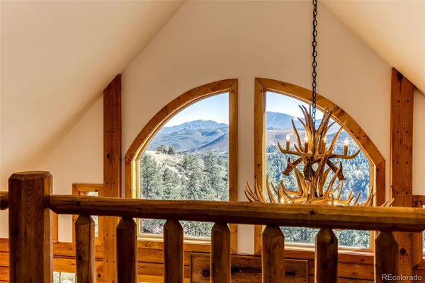 a view of a porch with a wooden fence