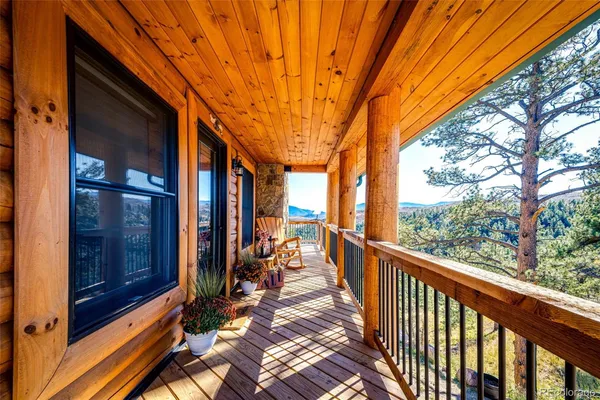 a view of a porch with wooden floor and outdoor space