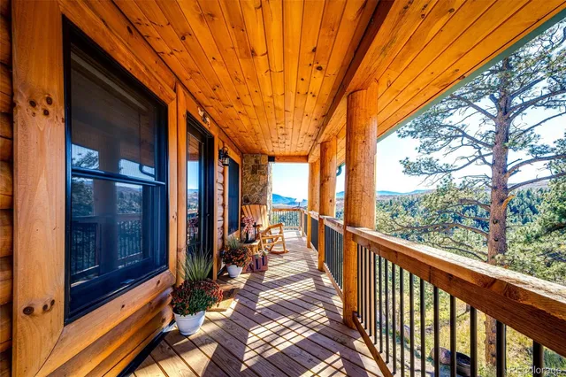 a view of a porch with wooden floor and outdoor space