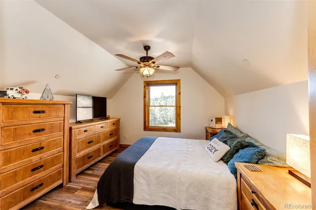 a bed room with a bed and a chandelier
