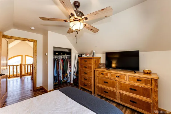 a view of a livingroom with furniture and a flat screen tv