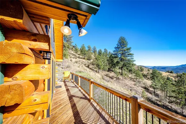 a view of a balcony with wooden floor