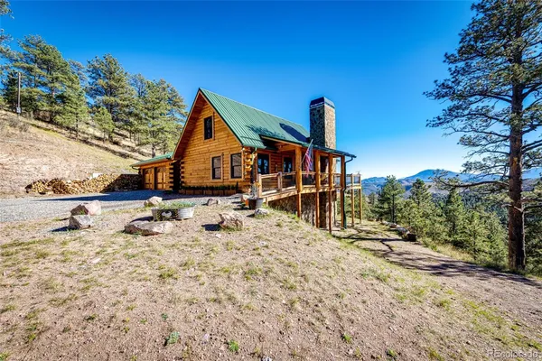 a roof deck with tall trees