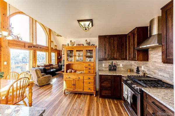 a kitchen with stainless steel appliances a stove a sink and a refrigerator