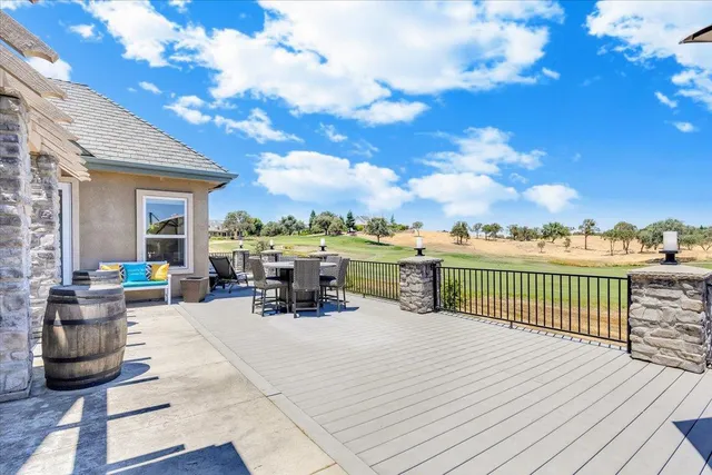 a view of a city with lots of residential buildings ocean and mountain view in back