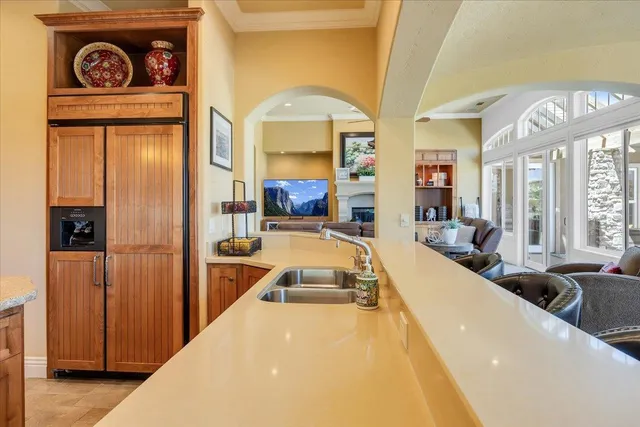 a view of a room that has a bed and a window in it