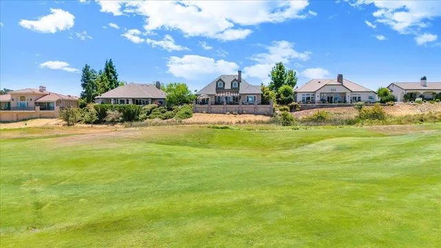 a bathroom with a sink vanity mirror and toilet