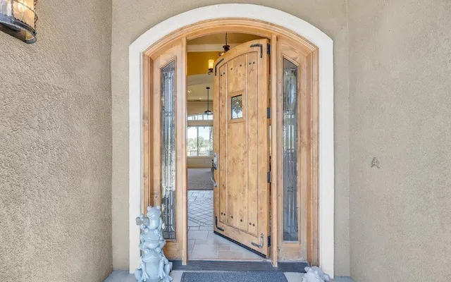 a kitchen with granite countertop a sink and cabinets