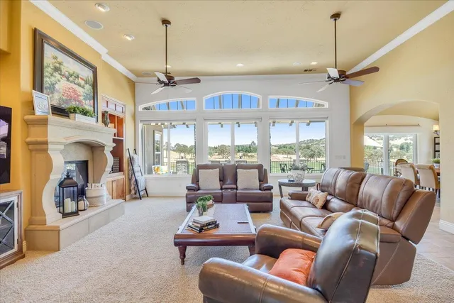 a kitchen with granite countertop white cabinets stainless steel appliances and sink