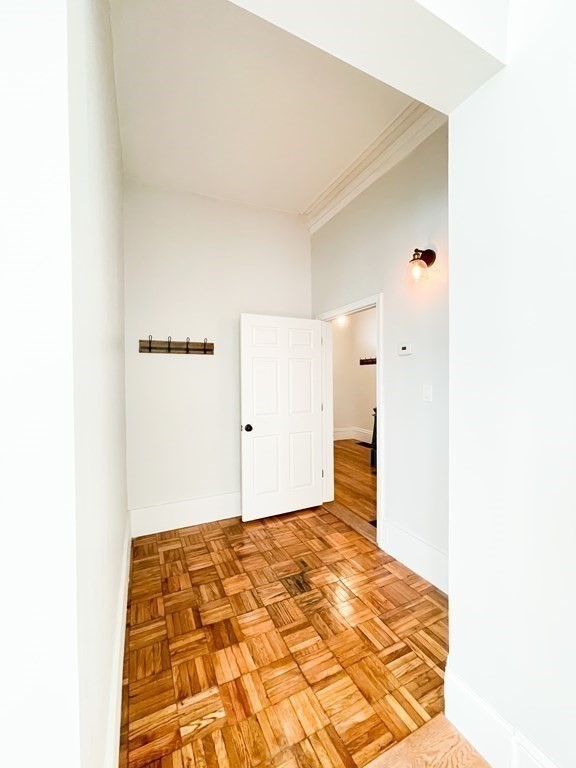 30 Woodbine Street Boston, MA 02119 - Photo 17 of 41 a bedroom with a bed and a painting on the wall