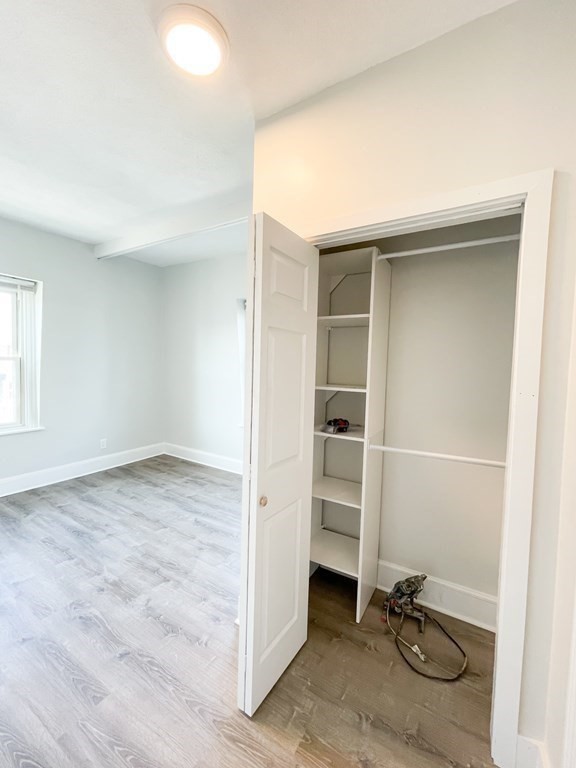 30 Woodbine Street Boston, MA 02119 - Photo 23 of 41 an empty room with a bench and a window