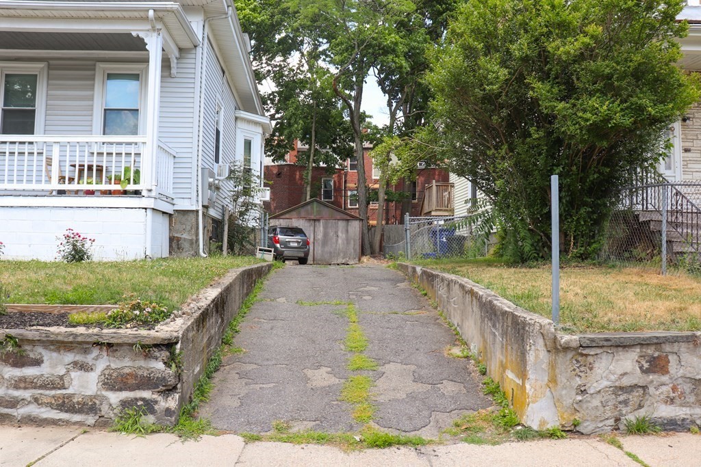 30 Woodbine Street Boston, MA 02119 - Photo 41 of 41 a front view of a house with a yard