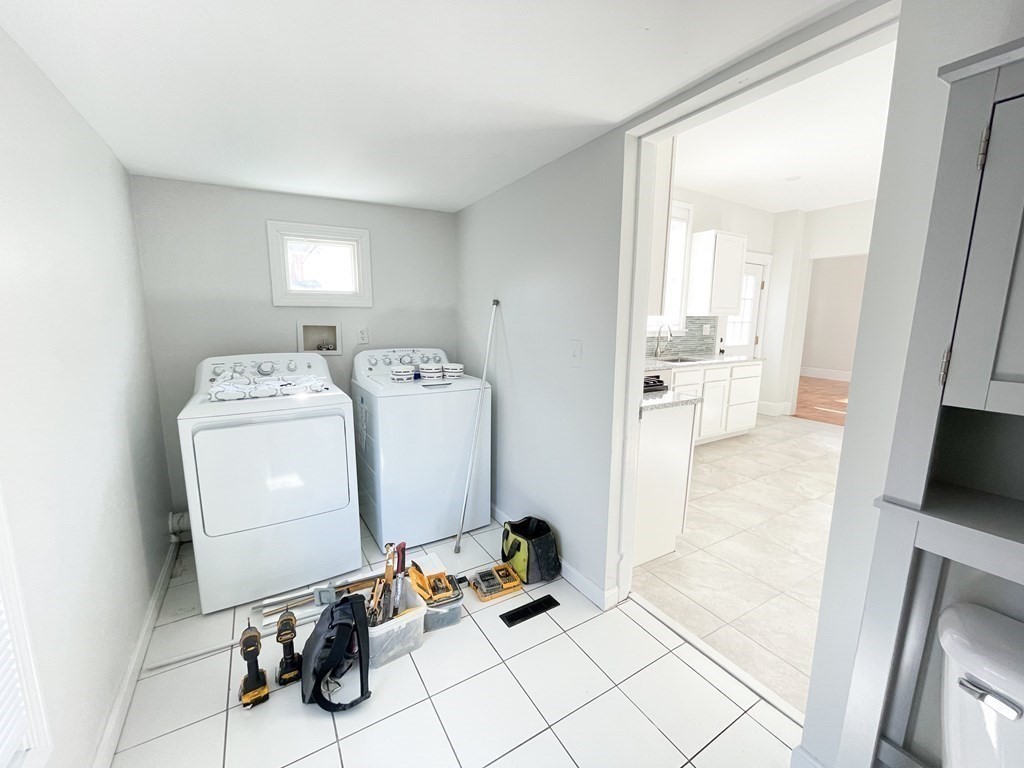 30 Woodbine Street Boston, MA 02119 - Photo 8 of 41 a utility room with dryer and washer