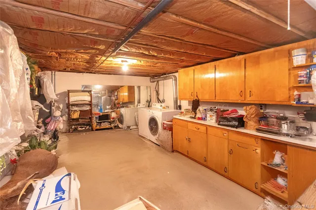 a view of a kitchen with furniture and a sink