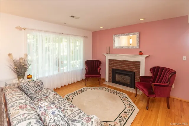 a spacious bedroom with a bed and a fireplace